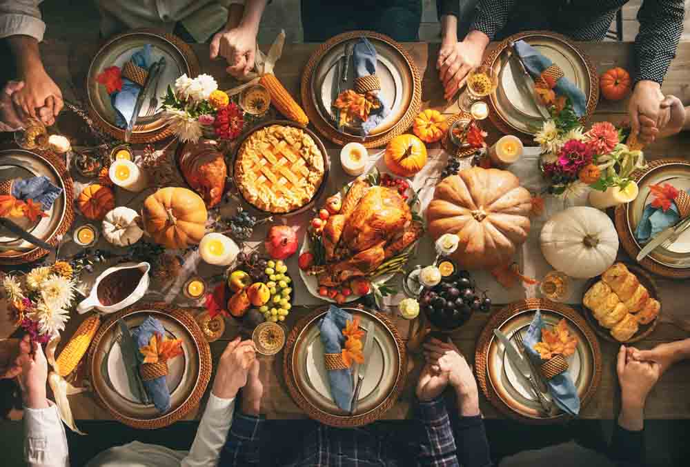 Thanksgiving feast with kitchen visible in background