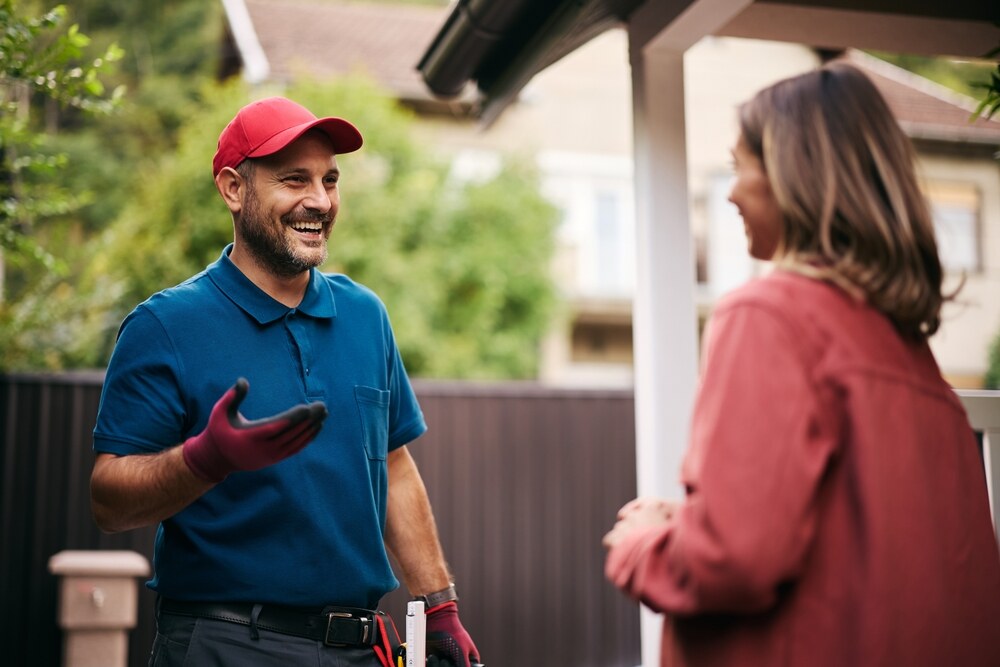 technician speaking with homeowner