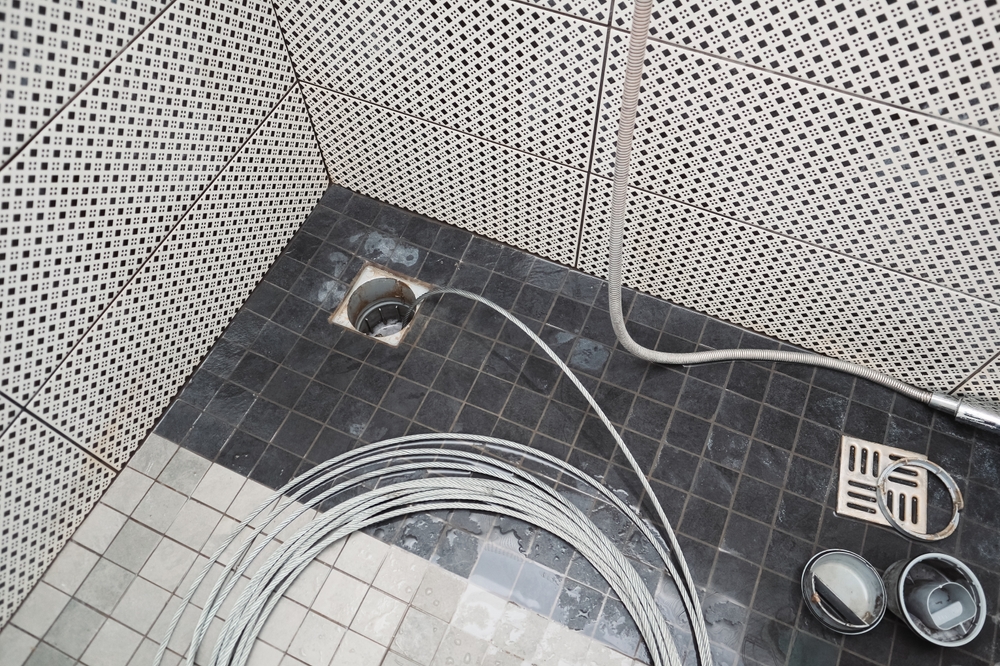 snaking clogged shower floor drain