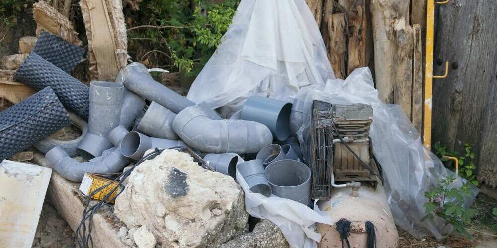 discarded pvc pipes and air compressor