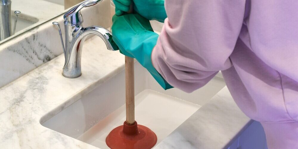 using cup plunger on clogged bathroom sink